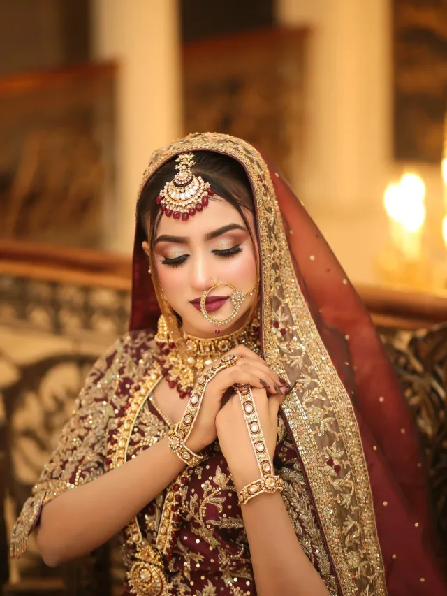 Bridal look — maroon lehenga candlelit hands folded